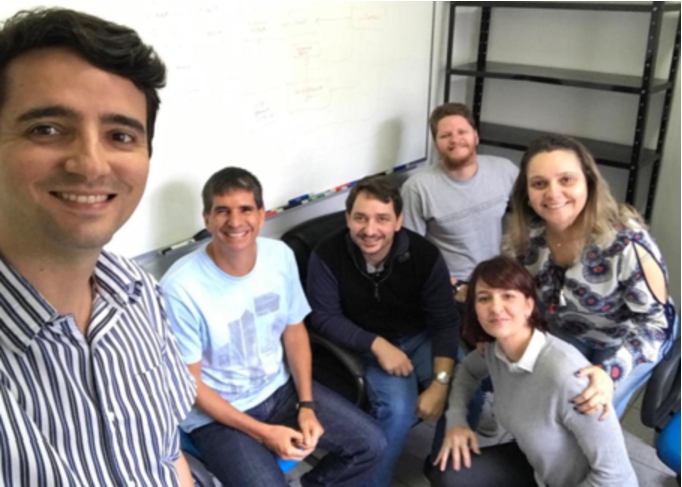 The NEMO Group (permanent staff): Vítor Souza (standing), Ricardo Falbo, João Paulo Almeida and Giancarlo Guizzardi (seated, from left to right), Monalessa Barcellos and Renata Guizzardi (from left to right in the foreground).