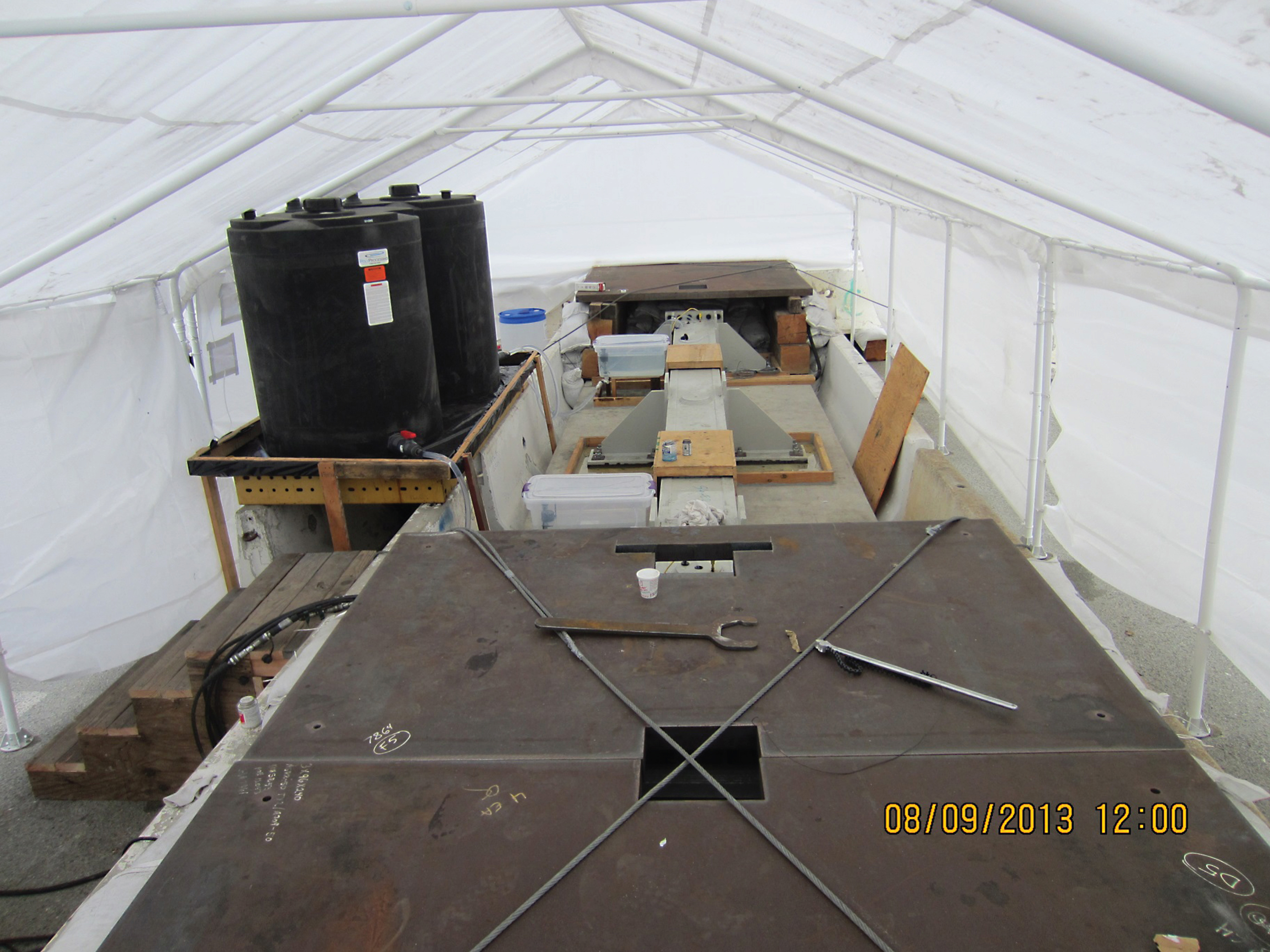 The test in progress under protective tent.