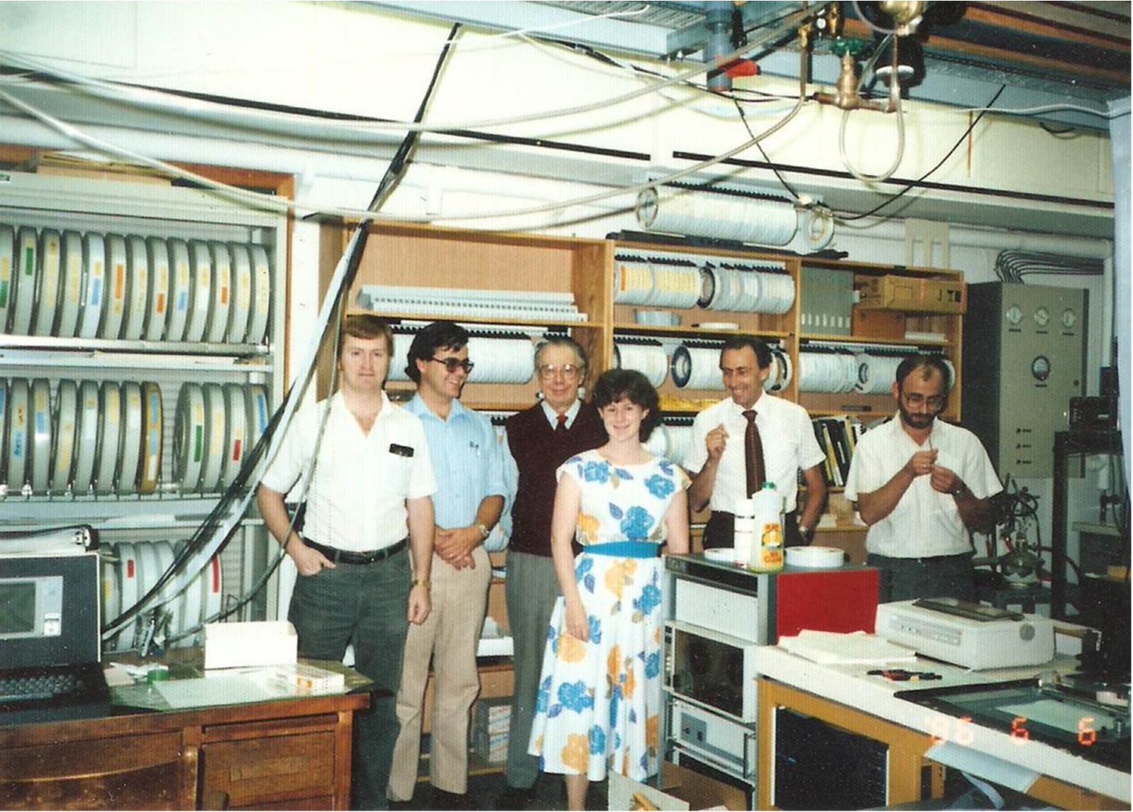 Norman Jones drops in on his former lab. Left to right: D. Moffatt (technician), H. Casal (postdoc), N. Jones (retired emeritus), S. Capes (student), H. Mantsch (author) and S. Surewicz (research associate). Note the NOVA data station in the foreground and the rack of magnetic tapes and disks in the background (personal photograph). (Colors are visible in the online version of the article; http://dx.doi.org/10.3233/BSI-150118.)