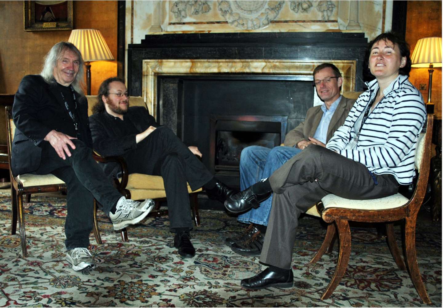 Four of the five organisers of the programme “Semantics & Syntax”: S. Barry Cooper, Benedikt Löwe, Arnold Beckmann, Elvira Mayordomo (from left to right). Photo taken by Sara Wilkinson in the Old Combination Room at Corpus Christi College, Cambridge, June 2012.