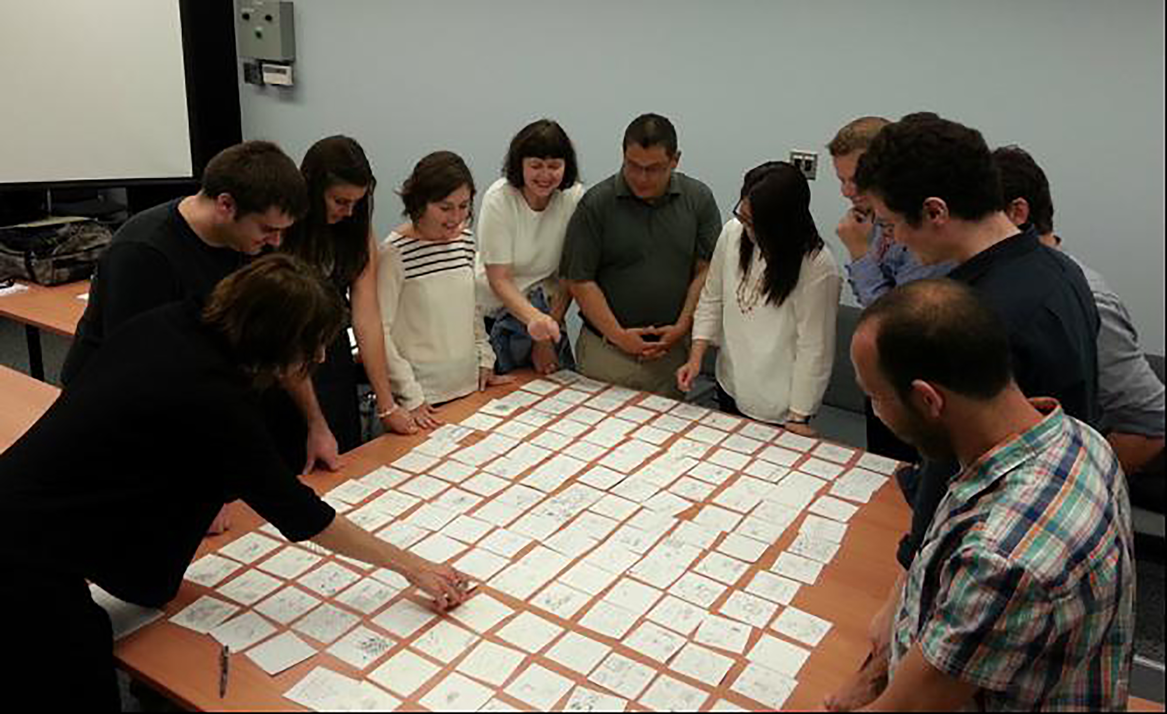 Doctoral students at the Faculty of Information, University of Toronto examine for the first time their drawings of information collected through the iSquare protocol version of the draw-and-write technique.
