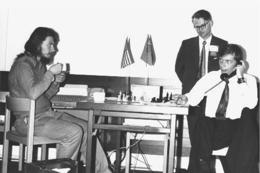 The 1st World Computer Chess Championship, Stockholm, 1974. Tech 2 (Alan Baisley) versus eventual champion Kaissa (Mikhail Donskoy), with unidentified spectator. (Photo: Monroe Newborn.)