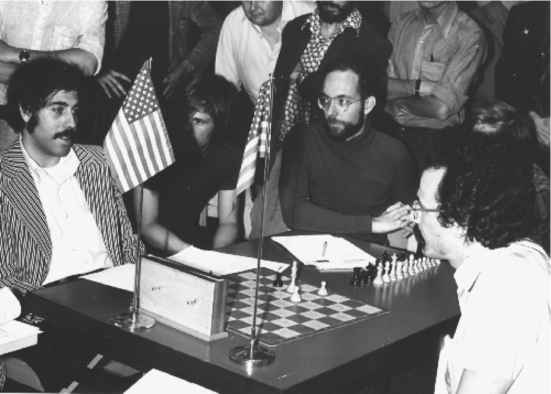 David Slate (left), co-author of Chess 4.0, playing Fred Swartz (center) and Victor Berman (right), co-authors of Chaos. The programs tied with Ribbit for the runner-up position in the 1974 World Championship. (Photo: Monroe Newborn.)