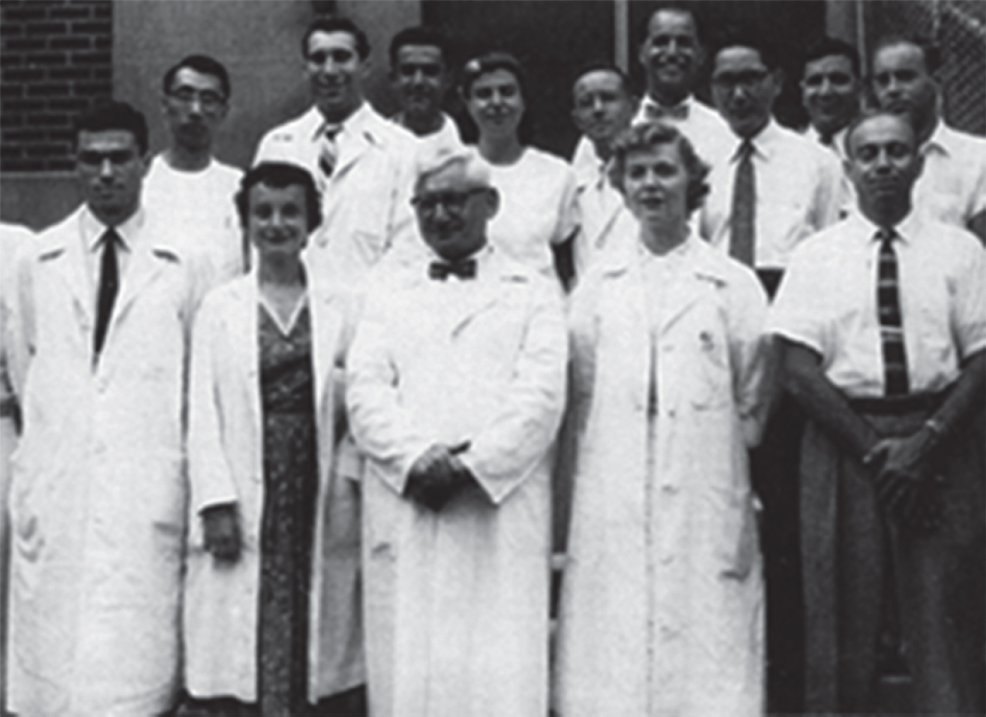 The Neuropathology group at the Montefiore Hospital in the 1950s. Front row (L to R): Bob Terry, Hilda Laufer, Harry Zimmerman, and Lucretia Allen. Back row: Asao Hirano, Nick Gonatas, Kleo Siderides, and Robert Belsky.