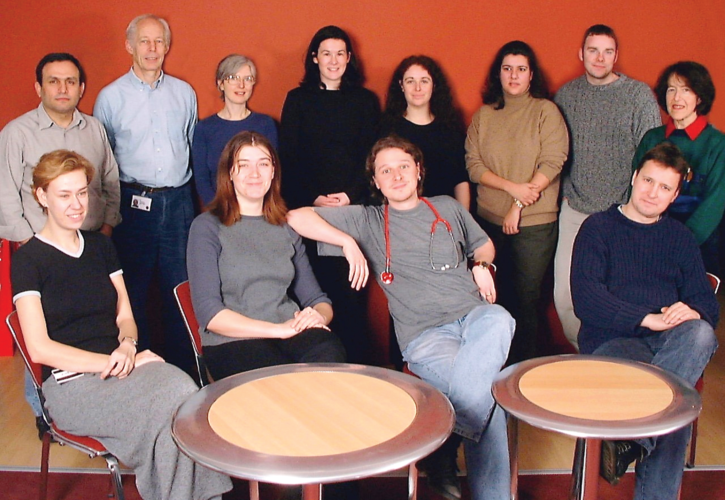 The silver jubilee. Picture of the Partridge lab around the turn of this century. From L to R the picture includes - Front row: Joanne Cousins, Sarah De Val, Pete Zammit, Jon Beauchamp. Back row: George Bou-Gharios, Terry Partridge, Jenny Morgan, Louise Heslop, TBN, Markella Ponticos, Jamie Morrison, Jacqueline Gross.