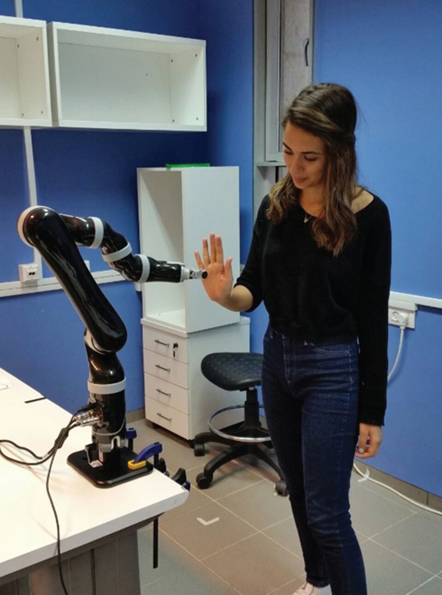 The experimental setup. Shown here is a participant playing the mirror game with the robotic partner.